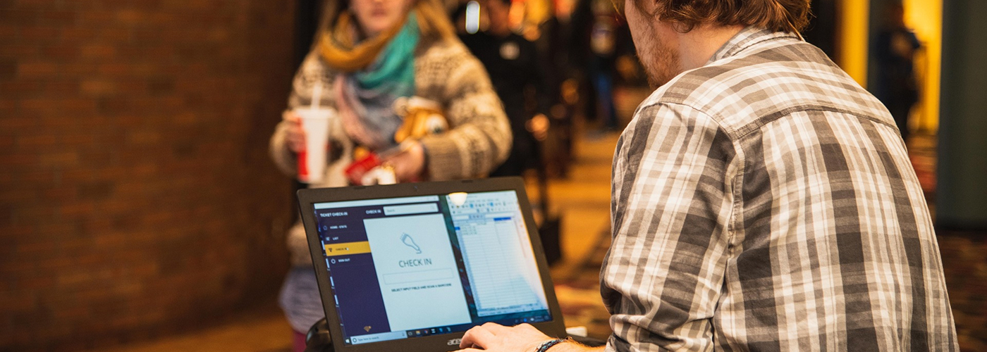 Staff scanning tickets at event entrance